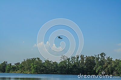 Rayong/Thailand- â€ŽNovember â€Ž21, â€Ž2018: Sikorsky S-70B-7 Seahawk Royal Thai Navy over the tree at U-Tapao Rayong Editorial Stock Photo